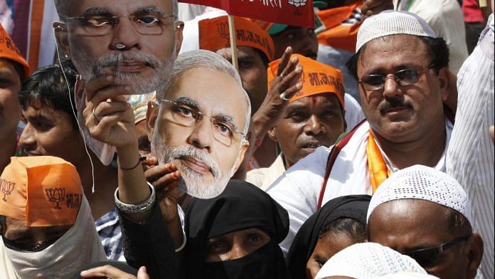 Muslim women supporters of BJP with masks of Narendra Modi | Arvind Yadav/Hindustan Times via Getty Images