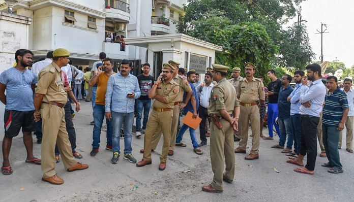 Police personnel at the residence of Vivek Tiwari