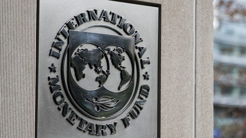Signage is displayed outside the IMF | Alex Wroblewski/Bloomberg