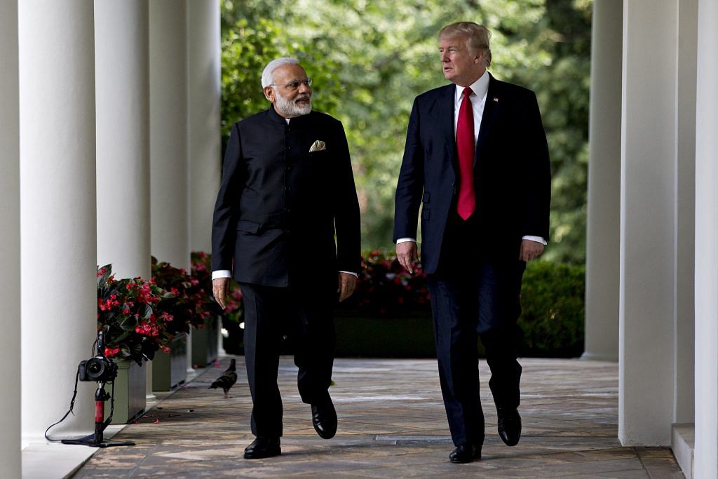 Narendra Modi and Donald Trump | Andrew Harrer/Bloomberg