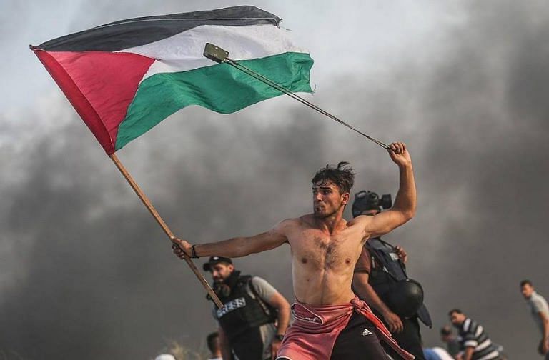 Shirtless Gaza protester invokes age-old image of liberty, Saudi, Trump at odds on Khashoggi murder