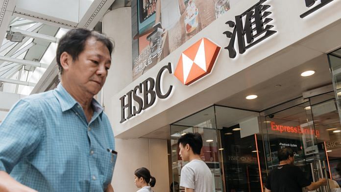 Pedestrians walk past an HSBC Holdings Plc bank branch in Hong Kong | Anthony Kwan/Bloomberg