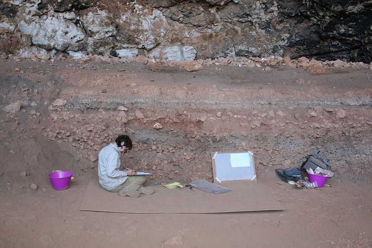 Amy Prendergast excavating a shell rich layer from the archaeological site of Haua Fteah | Giulio Lucarini, University of Cambridge