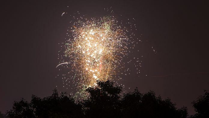 A firework lights up the sky during Diwali celebrations | Prashanth Vishwanathan/Bloomberg