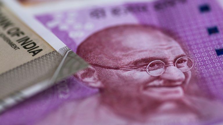RBI hand seen as rupee holds amid cooling oil prices