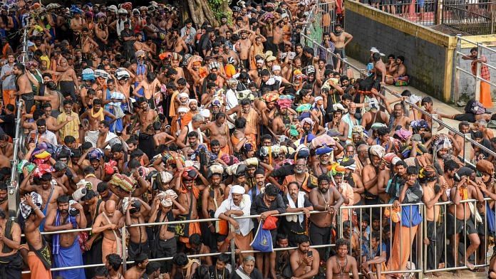 Devotees wait for opening of the Lord Ayyappa Temple in Sabarimala | PTI