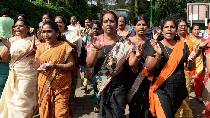 Devotees and activist protest against the Supreme Court verdict revoking a ban on women's entry to Sabarimala's Ayyappa Hindu temple | Getty Images