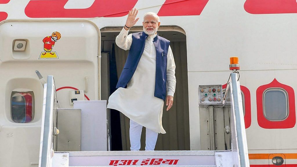Prime Minister Narendra Modi waves as he emplanes for Maldives to attend the historic swearing-in ceremony of President-elect Ibrahim Mohamed Solih in New Delhi