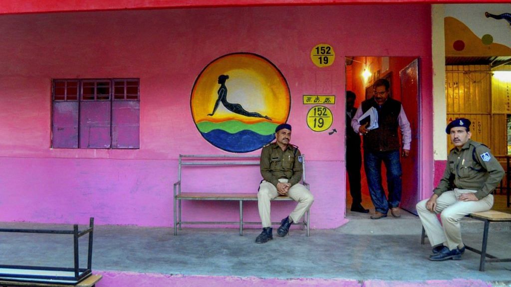 Security personnel outside a 'pink' polling booth for women ahead of Madhya Pradesh assembly election | PTI