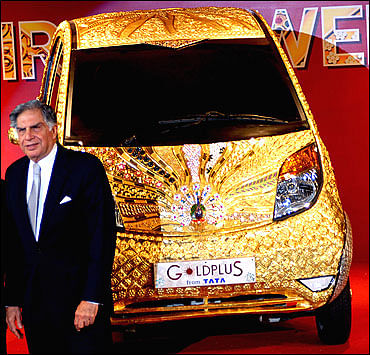 Tata Nano and Jaguar covered in gold 