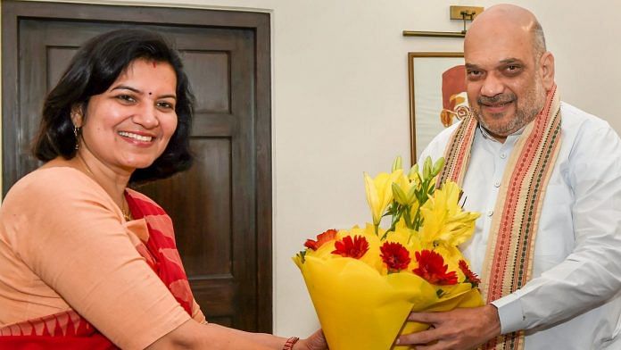 Bharatiya Janata Party president Amit Shah receives a bouquet from former IAS officer Aparajita Sarangi in New Delhi | Atul Yadav/PTI