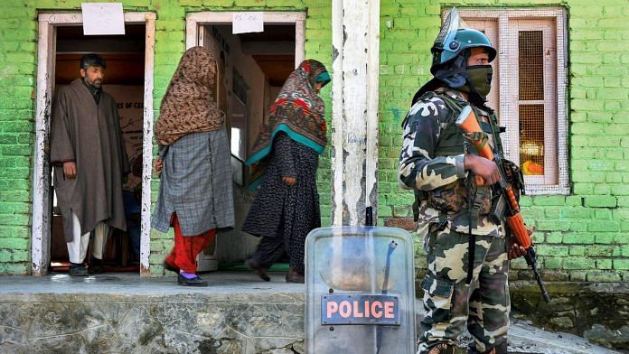 Security personnel guard a polling station in Kashmir | S. Irfan/PTI