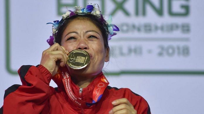 Mary Kom kisses her gold medal after winning the final match of women's light flyweight 45-48 kg against Ukraine's Hanna Okhota at AIBA Women's World Boxing Championships in New Delhi | Ravi Choudhary/PTI