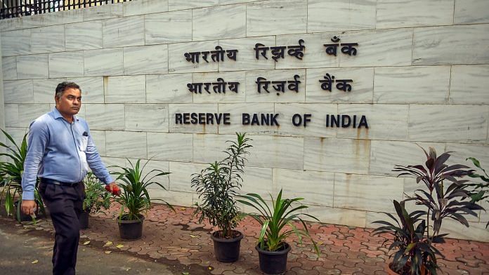 A man walks past the Reserve Bank of India headquarters in Mumbai | Shashank Parade/ PTI