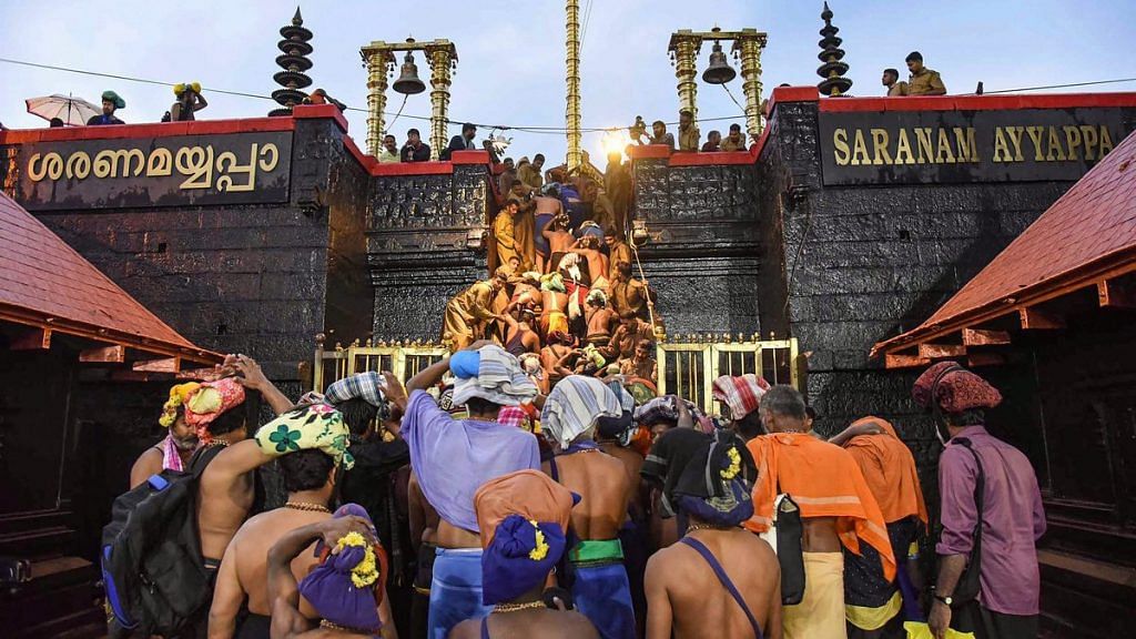 Devotees enter the Sabarimala temple as it opens amid tight security, November 2018 | PTI