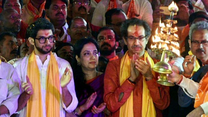 Shiv Sena chief Uddhav Thackeray, Yuva Sena chief Aditya Thackeray and Rashmi Thackeray offer prayers during Saryu aarti at a ghat in Ayodhya | PTI