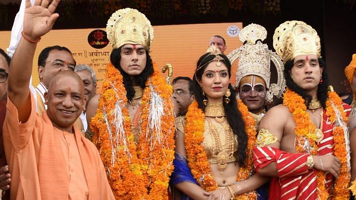 Uttar Pradesh CM Yogi Adityanath welcomes artistes dressed up as Lord Rama, Sita and Lakshman in Ayodhya | Deepak Gupta/Hindustan Times via Getty Images