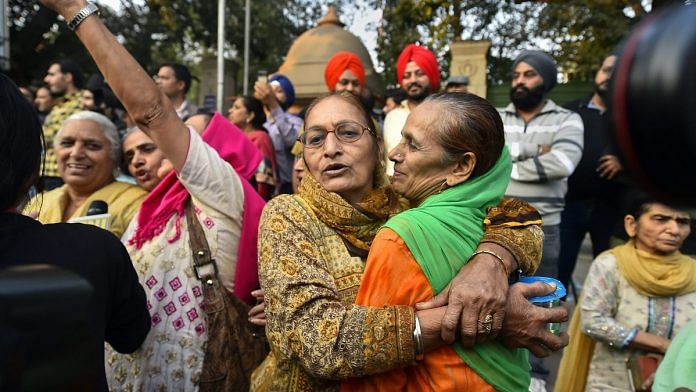 Family members of the victims of 1984 anti-Sikh riots celebrate outside the Patiala House Court in New Delhi after the pronouncement of the first death punishment in the case | PTI