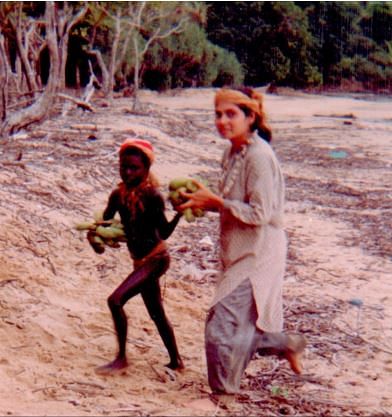 Madhumala along with a young Jarawa girl helping in the daily chores. The bead necklace around Madhumala’s neck is a gift from the tribe