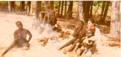 Madhumala with the Jarawa women. Madhumala is the first woman anthropologist who could assimilate with the Jarawas much before the Jarawa came out of their seclusion. Seen in the picture- food being cooked over fire by a Jarawa woman. Jarawas know how to make fire and use the drill method to produce it