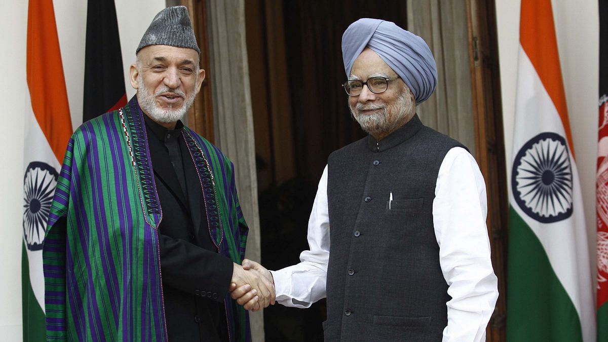 Agreement Singing Ceremony Between India And Afganistan Afghanistan President Hamid Karzai (L) shakes hand with Prime Minister Manmohan Singh | Vipin Kumar / Getty Images