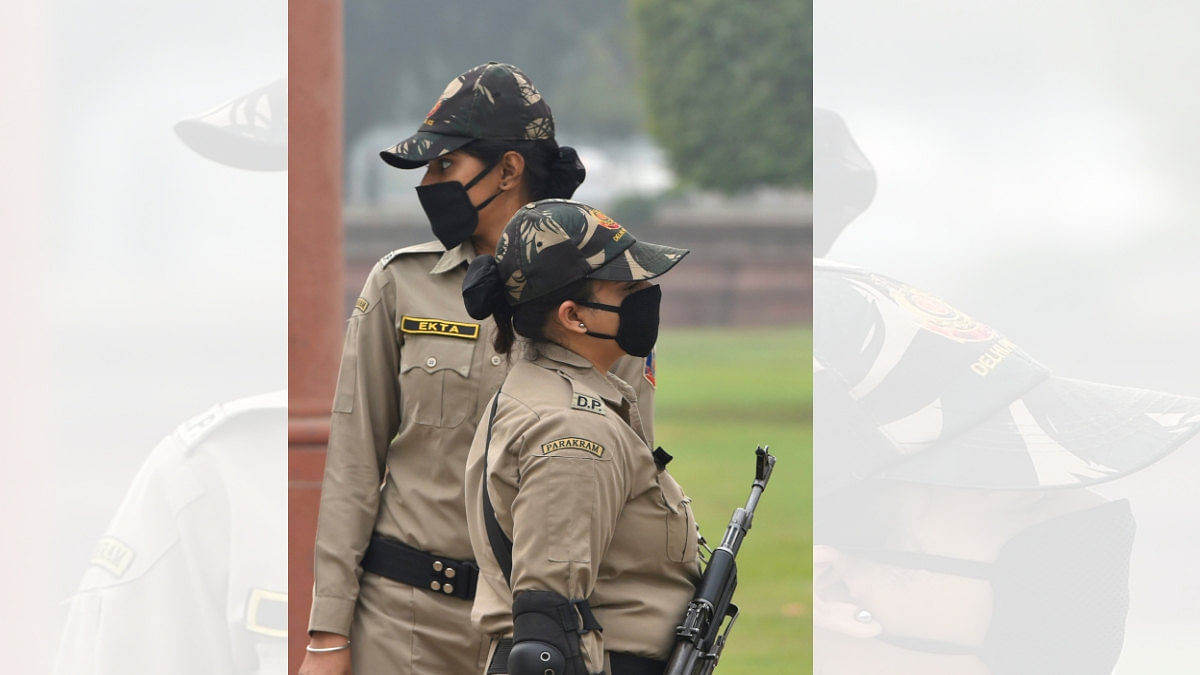 Police personnel wear masks for protection against air pollution in New Delhi
