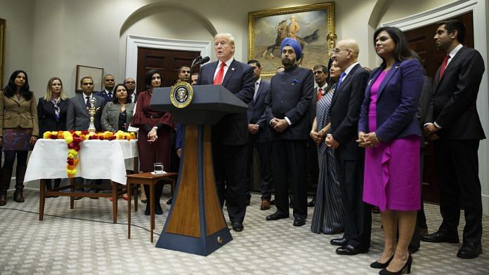 U.S. President Donald Trump (C) speaks during a Diwali ceremonial lighting of the diya event at the White House | Joshua Roberts/Bloomberg