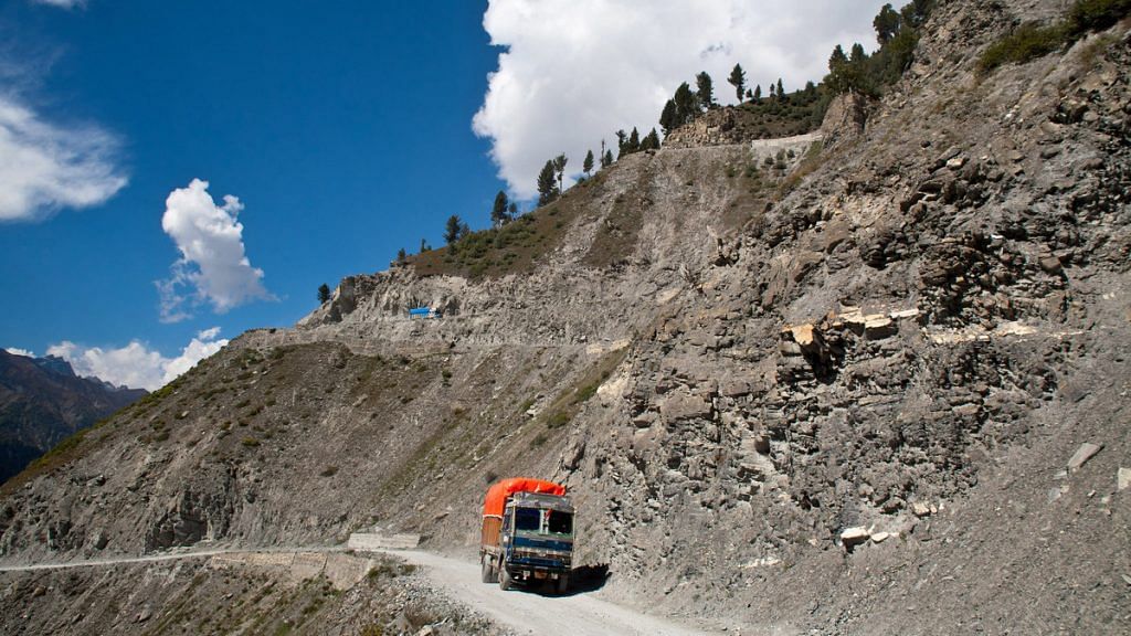 A truck carries supplies to Ladakh on a treacherous road of Zojila Pass