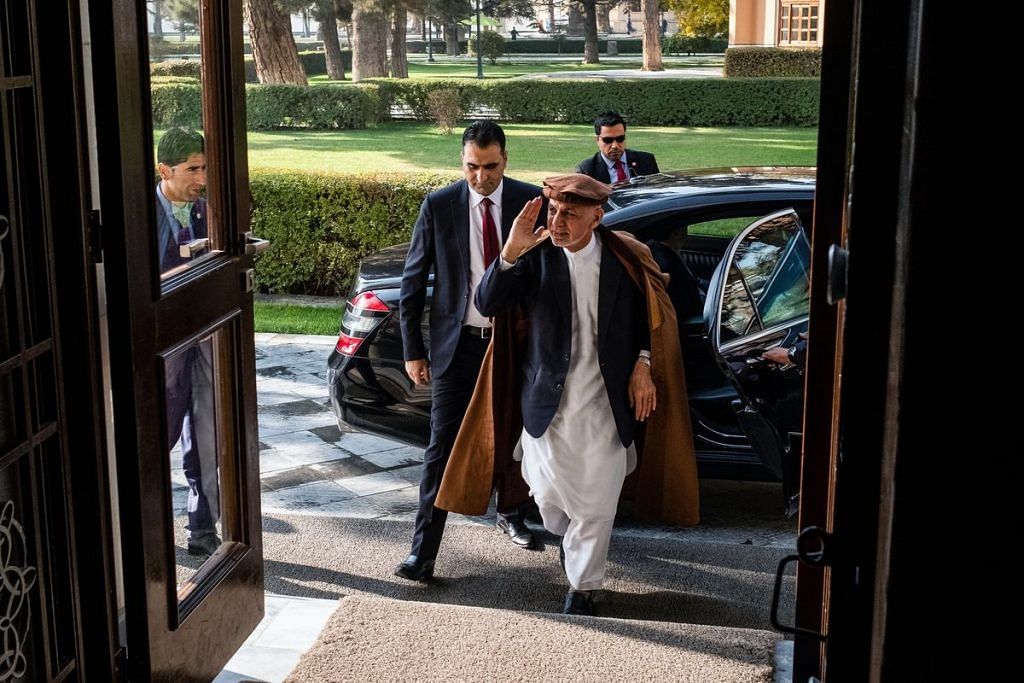 Ashraf Ghani, Afghanistan's president, center, arrives at the Presidential Palace in Kabul, Afghanistan