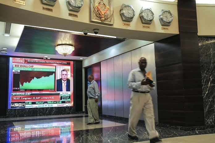 A screen displays stock news inside the Bombay Stock Exchange (BSE) building in Mumbai, India, on Tuesday, Dec. 11, 2018. Indias new central bank governor has a list of challenges to face as he takes office: from fixing a banking crisis to convincing investors of the institutions autonomy