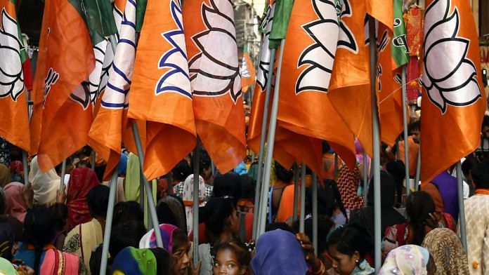 Supporters of BJP carry flags during a rally in Bhopal