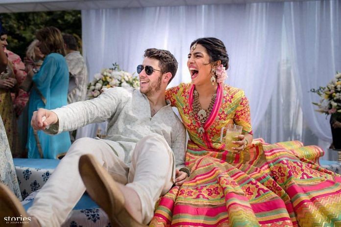 Priyanka Chopra and Nick Jonas celebrate during their mehendi ceremony