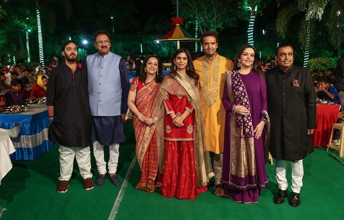 Isha Ambani, fiance Anand Piramal, and their respective families pose for a photo ahead of the wedding | PTI