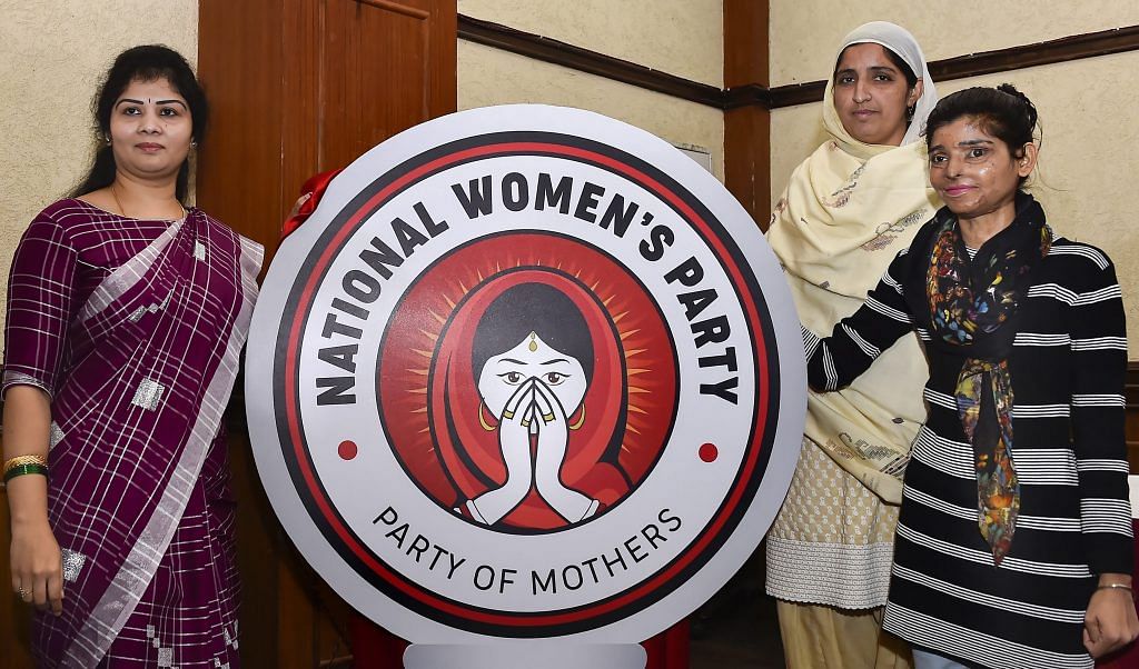 National Women's Party Chairperson Swetha Shetty (L) with acid attack victims unveil the party logo during the launch of what is claimed to be the country's first women's national level policital party