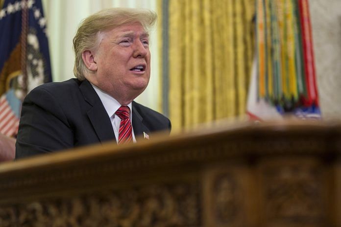 US President Donald Trump addresses US armed forces members on a Christmas Day video conference call in the Oval Office at the White House in Washington