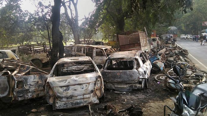 Charred vehicles which were set on fire by a mob in Monday's violent clashes over the alleged slaughter of cattle, in UP's Bulandshahr district | PTI