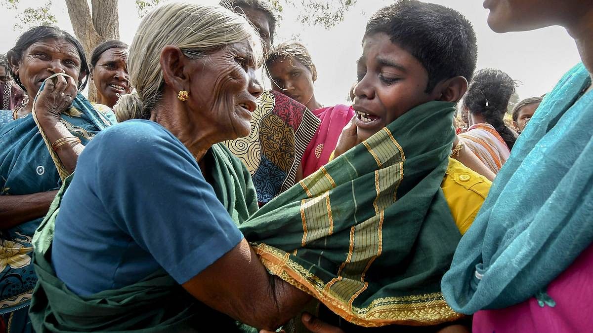 Latest news on Karnataka | ThePrint A boy being consoled by his grandmother after his mother died of suspected food poisoning at Bidarahalli, near Sulawadi village in Chamarajnagar district of Karnataka