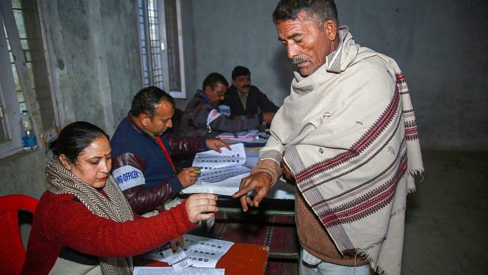 An election officer put an indelible ink mark on the finger of a voter | PTI