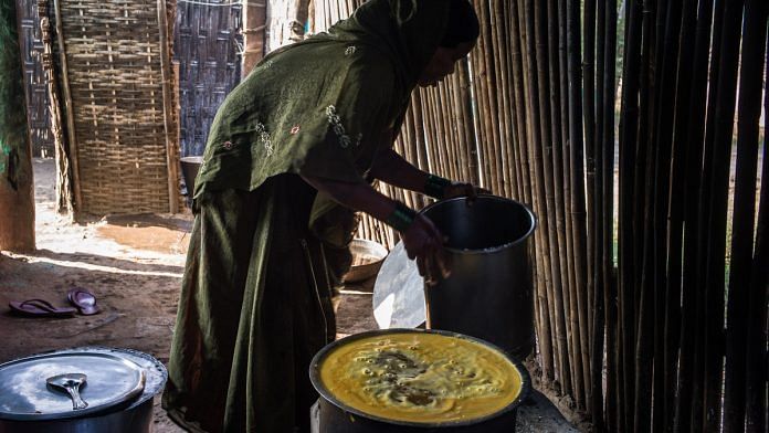 An anganwadi worker cooks for children under the ICDS scheme | Sanjit Das/Bloomberg