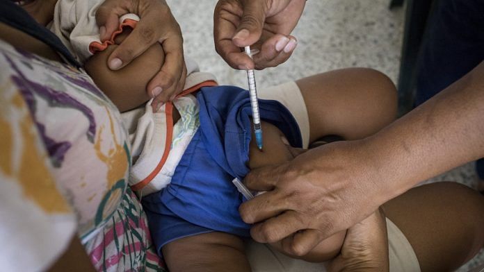 A months-old baby receives vaccinations. | Nicolo Filippo Rosso/Bloomberg