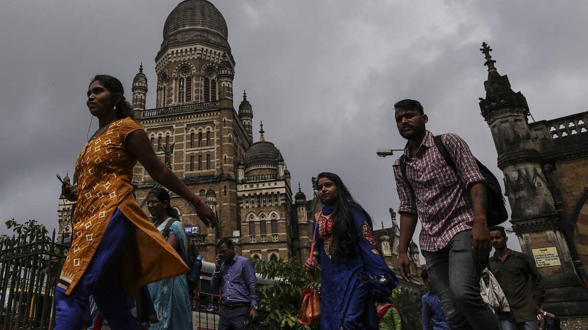 Commuters and pedestrians walk past the Chhatrapati Shivaji Terminus railway station in Mumbai (Representational image)