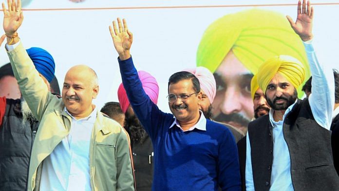 File photo of AAP's Arvind Kejriwal, Manish Sisodia and Bhagwant Mann during a rally in Barnala | PTI