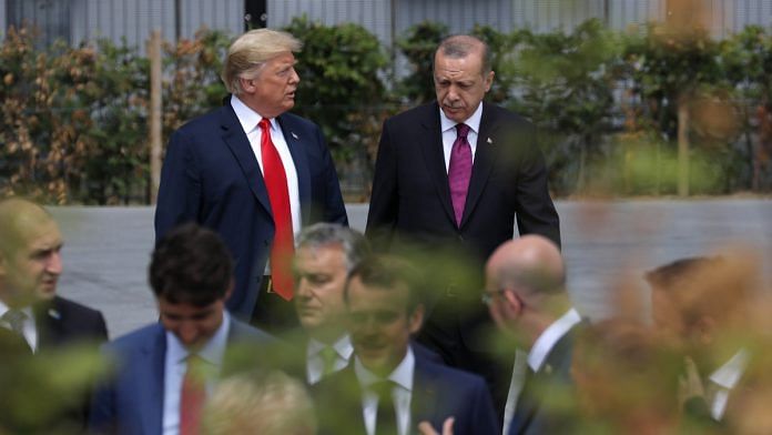 US President Donald Trump, left, walks with Recep Tayyip Erdogan, Turkey's president