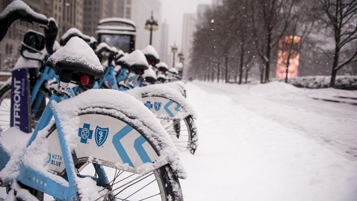 Bicycles covered in snow