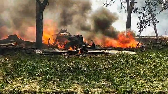 Flames rise out of a burning IAF Jaguar aircraft that crashed after taking off from Gorakhpur, in Kushinagar | PTI