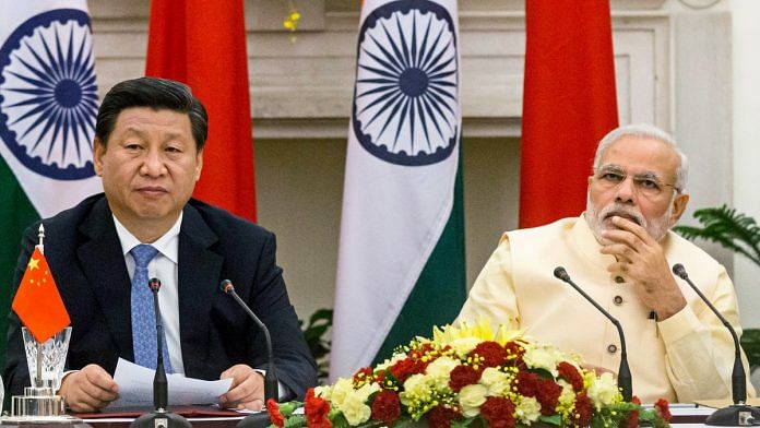 Narendra Modi and Xi Jinping | Graham Crouch/Bloomberg