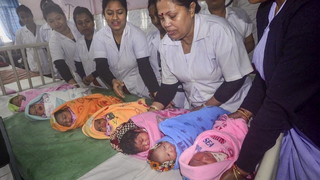 Nurses hold babies | PTI