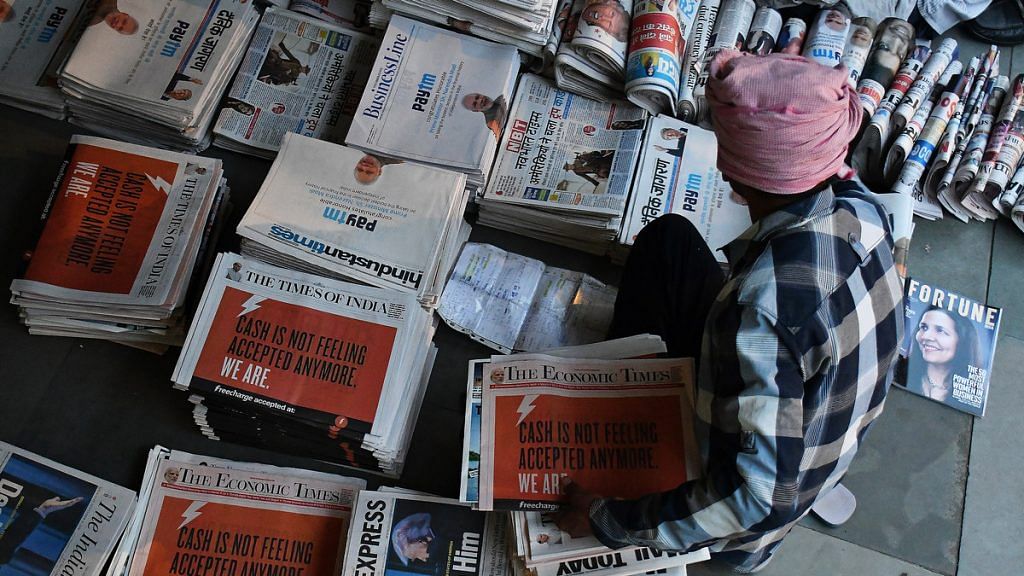 A newspaper vendor at a distribution centre in New Delhi | Anindito Mukherjee/Bloomberg