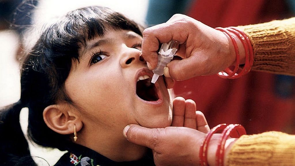 A child receives an oral Polio vaccine | Flickr