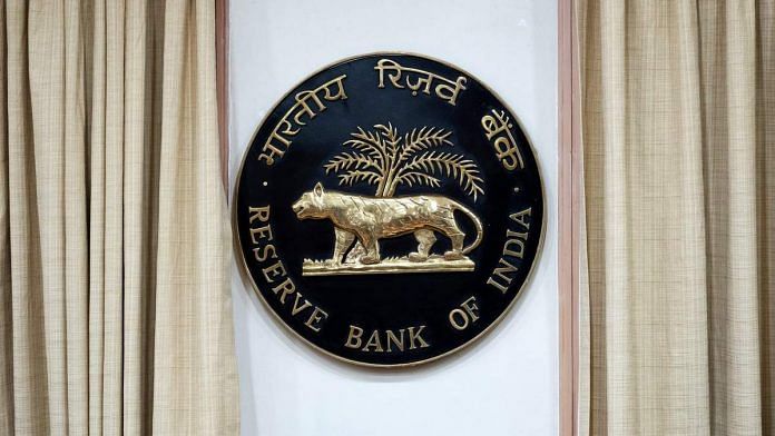 The Reserve Bank of India (RBI) logo is displayed inside the central bank building in Mumbai